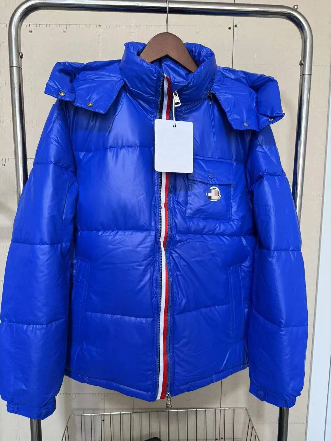 Moncler navy puffer jacket in cold-weather street style - Image 4
