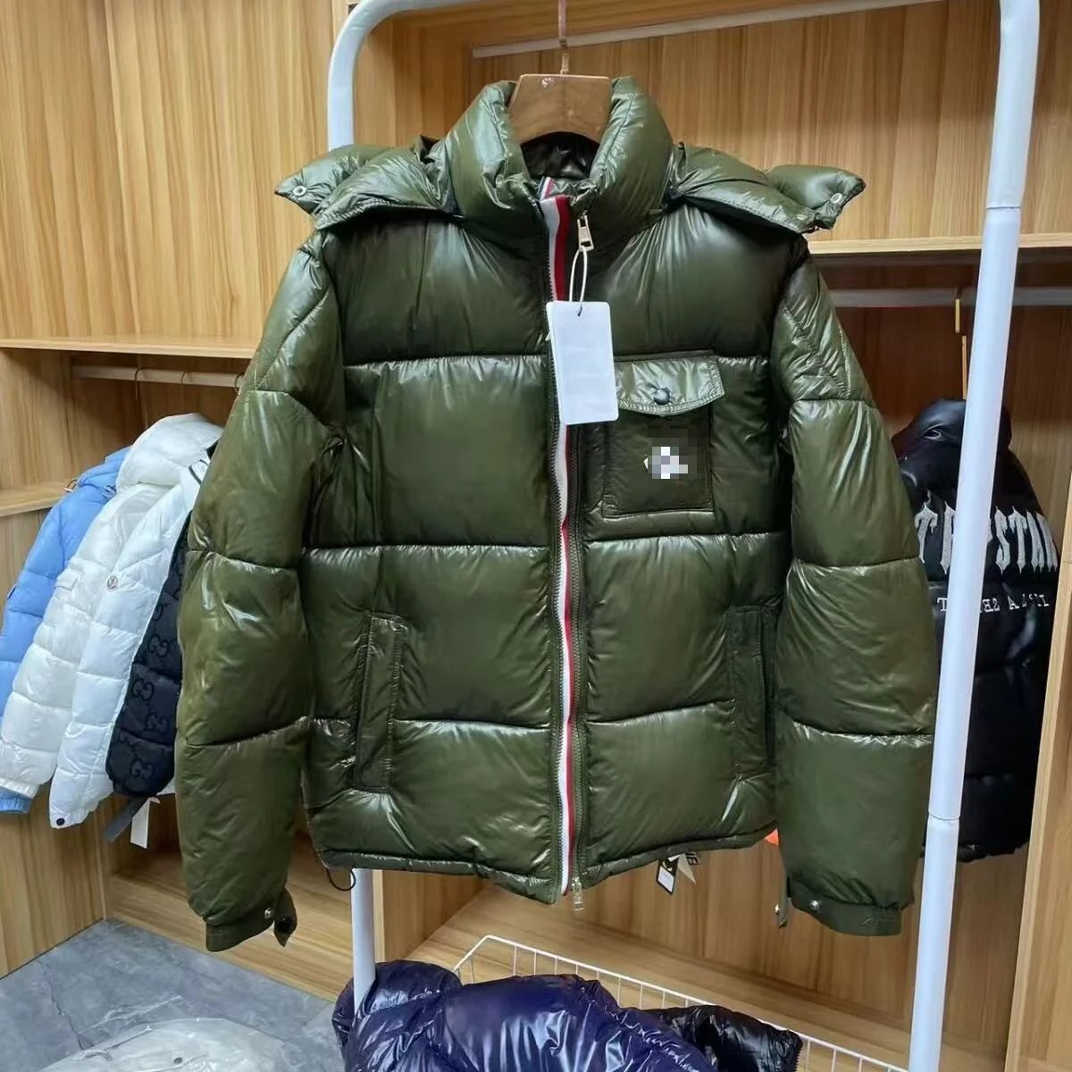 Moncler navy puffer jacket in cold-weather street style - Image 5