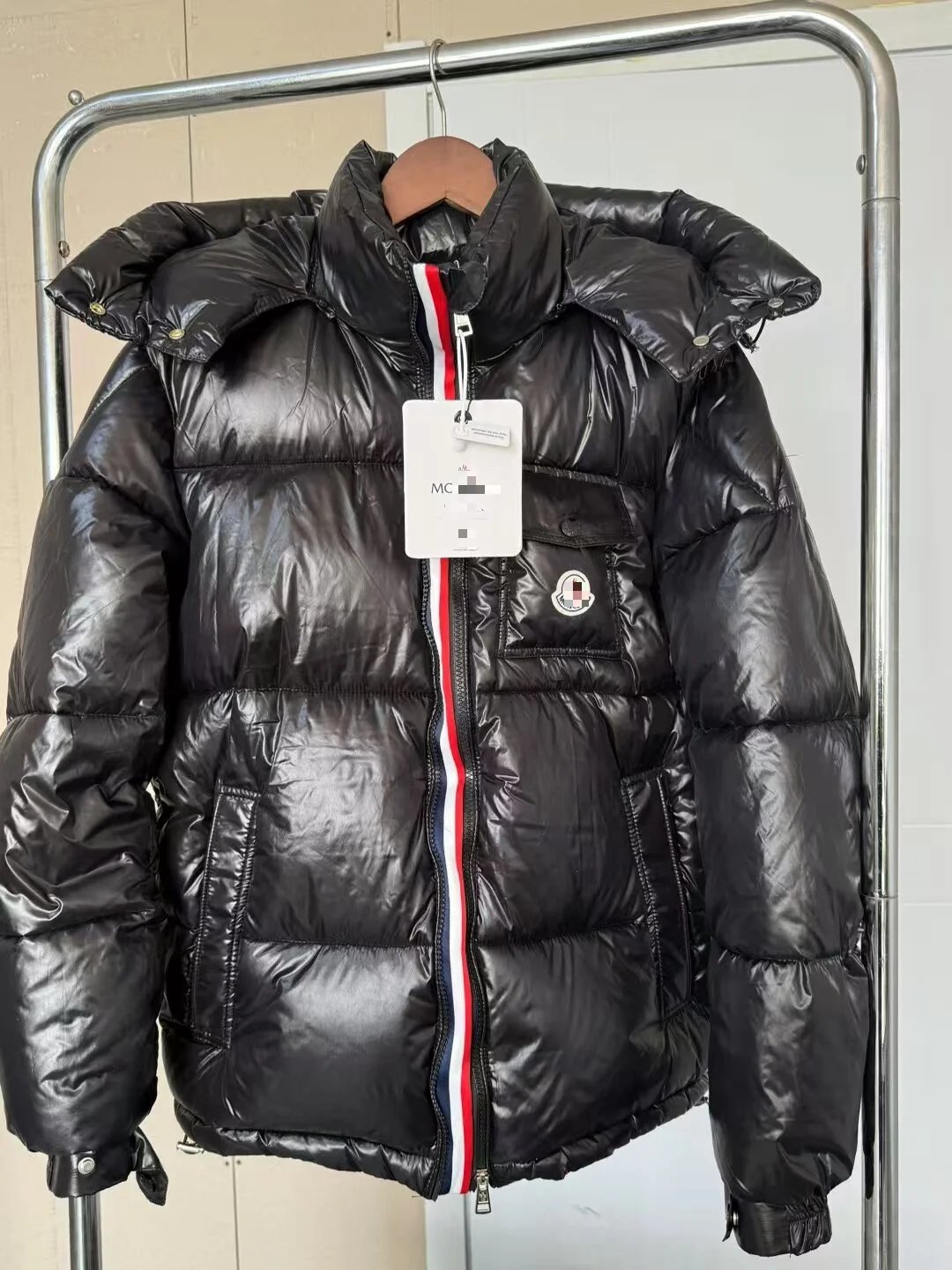Moncler navy puffer jacket in cold-weather street style - Image 7
